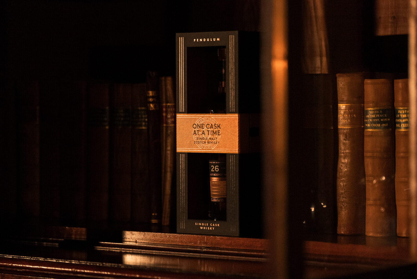 One Cask at a Time Pendulum single cask whisky presentation box on a library shelf